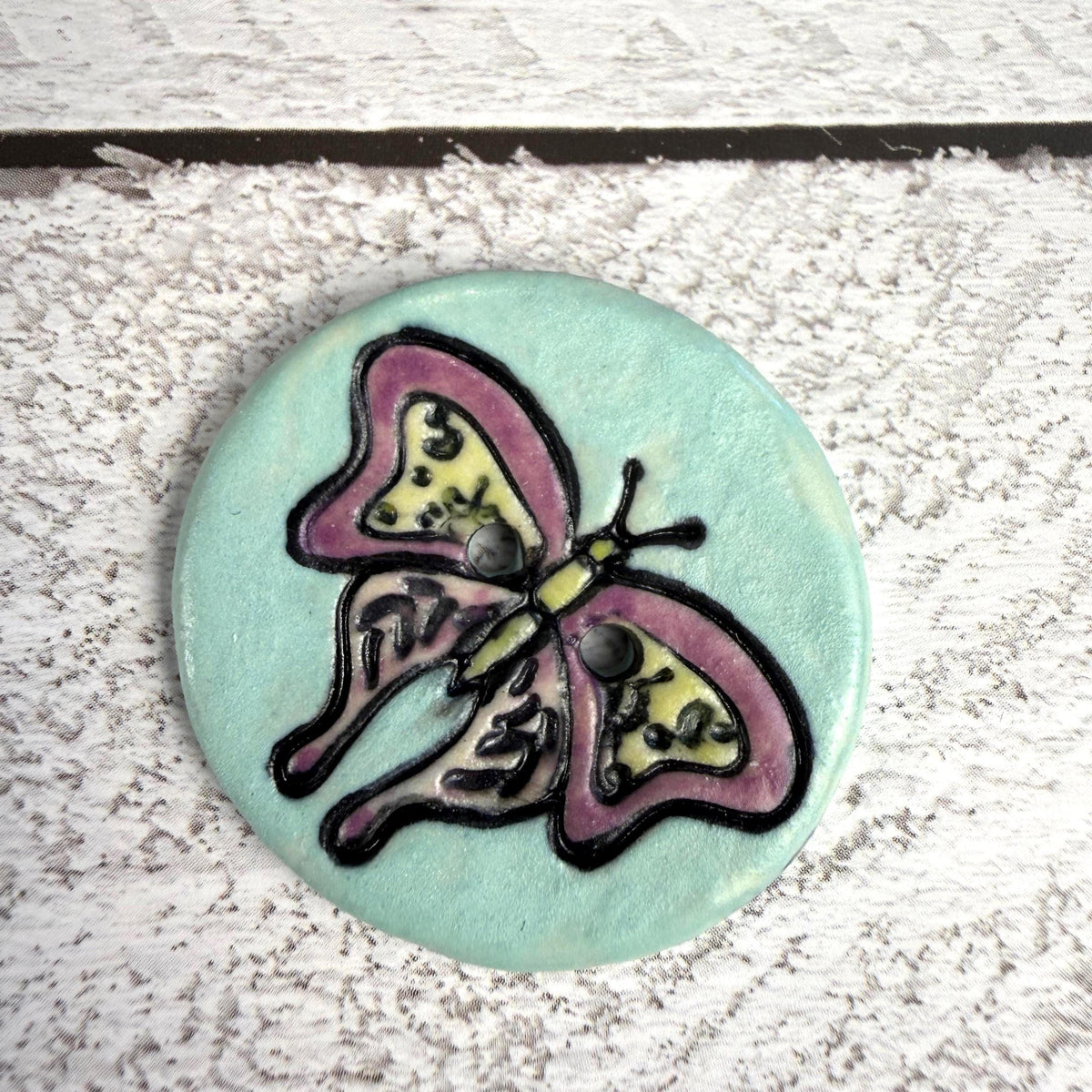 Red Violet Moth with Yellow on Aqua Blue Ceramic Button