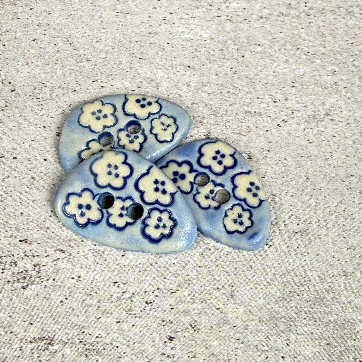 Set of 5 Small Blue Triangular Shaped Buttons with White Flowers