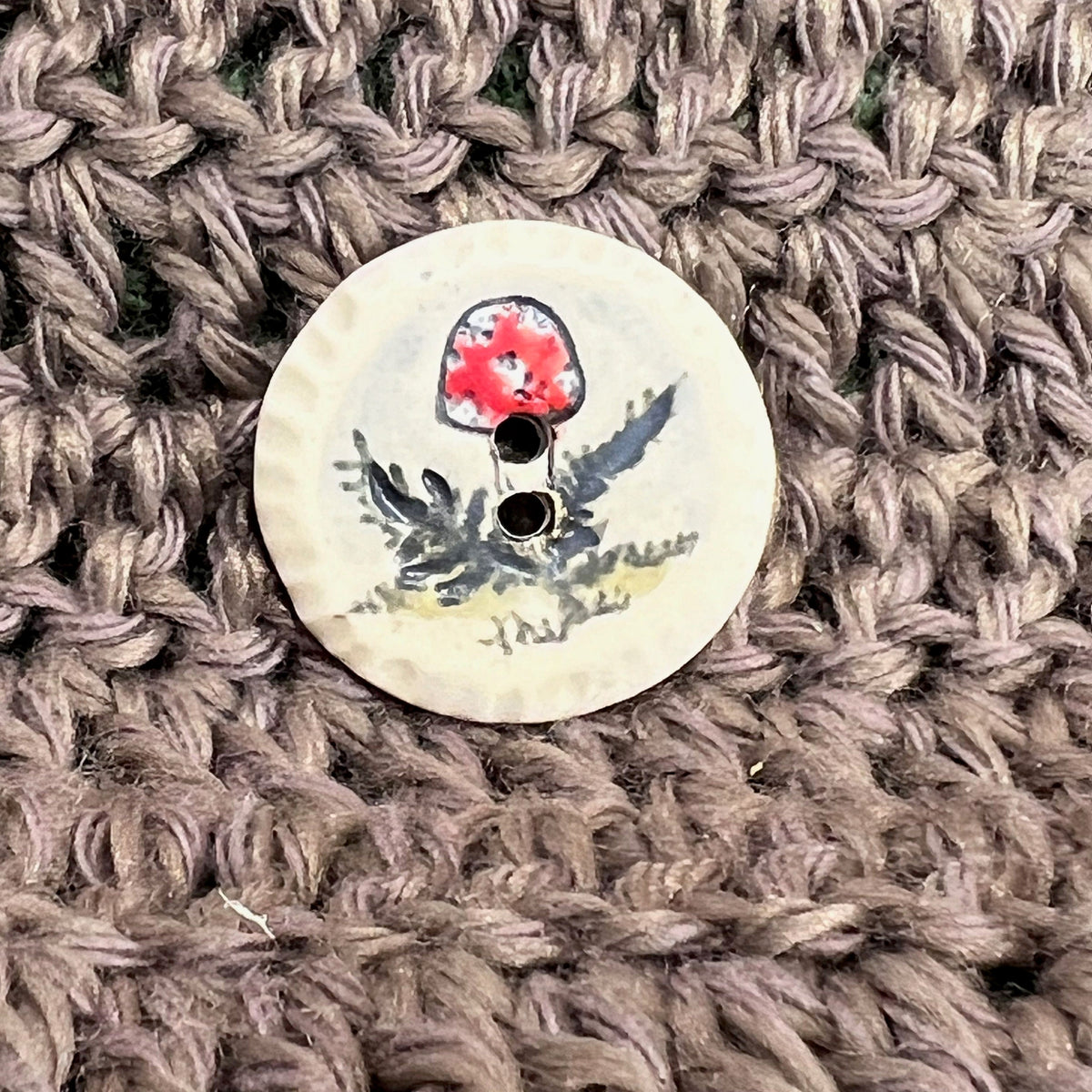 Red and White Cap Mushroom with Fern on White Round Button