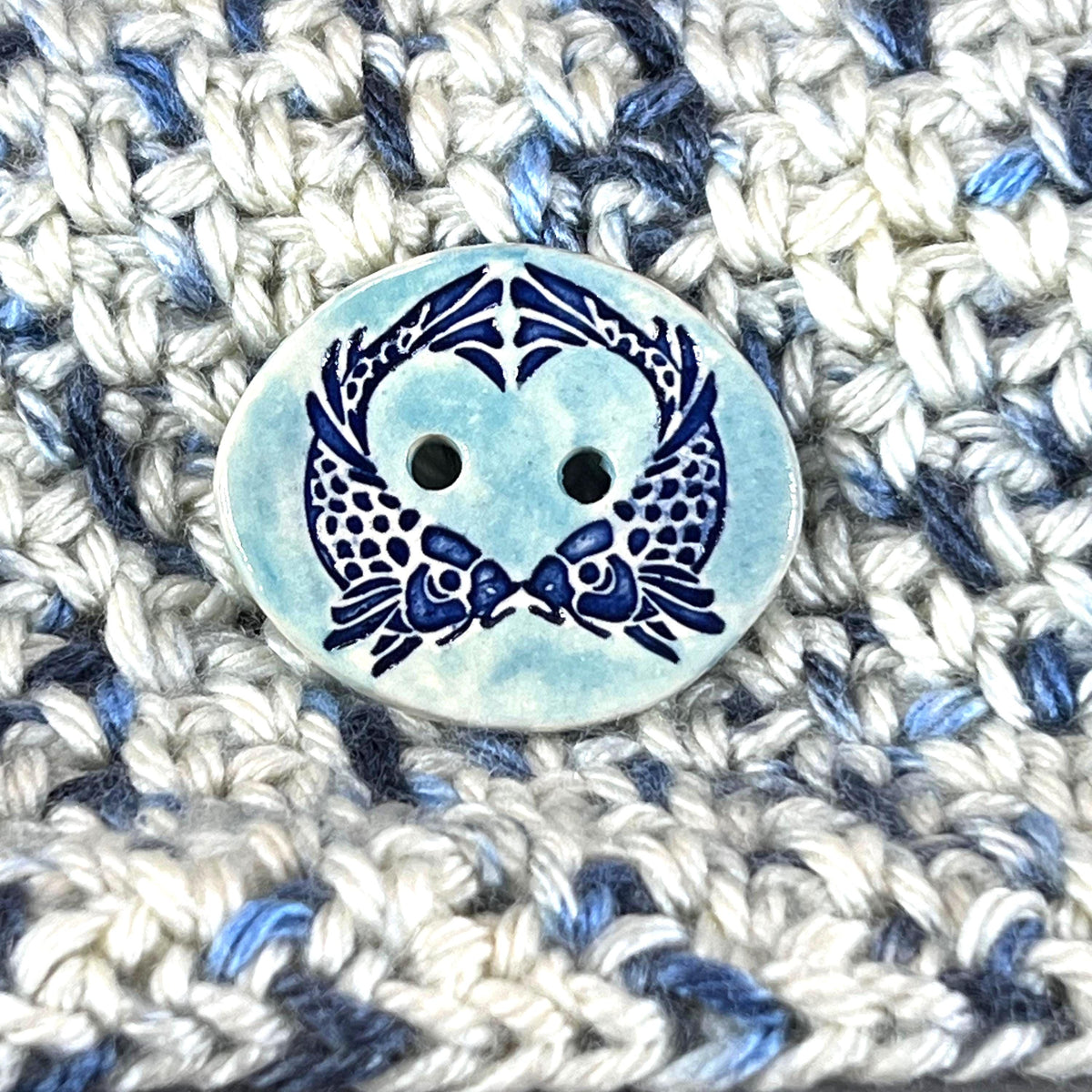 Two Koi Heart on Light Blue Oval Button