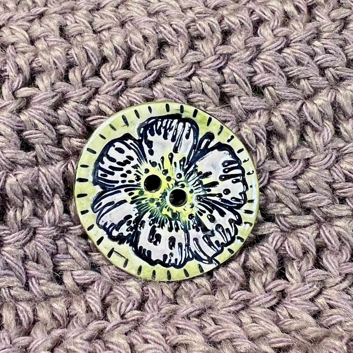 Large Button with Light Lavender Flower and Green Border