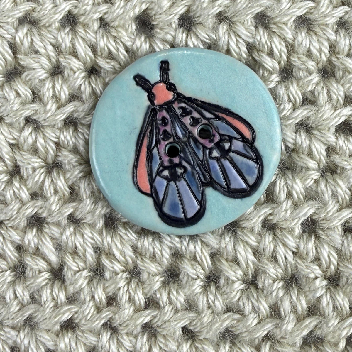 Blue Moth with Eyes on Aqua Blue Ceramic Button