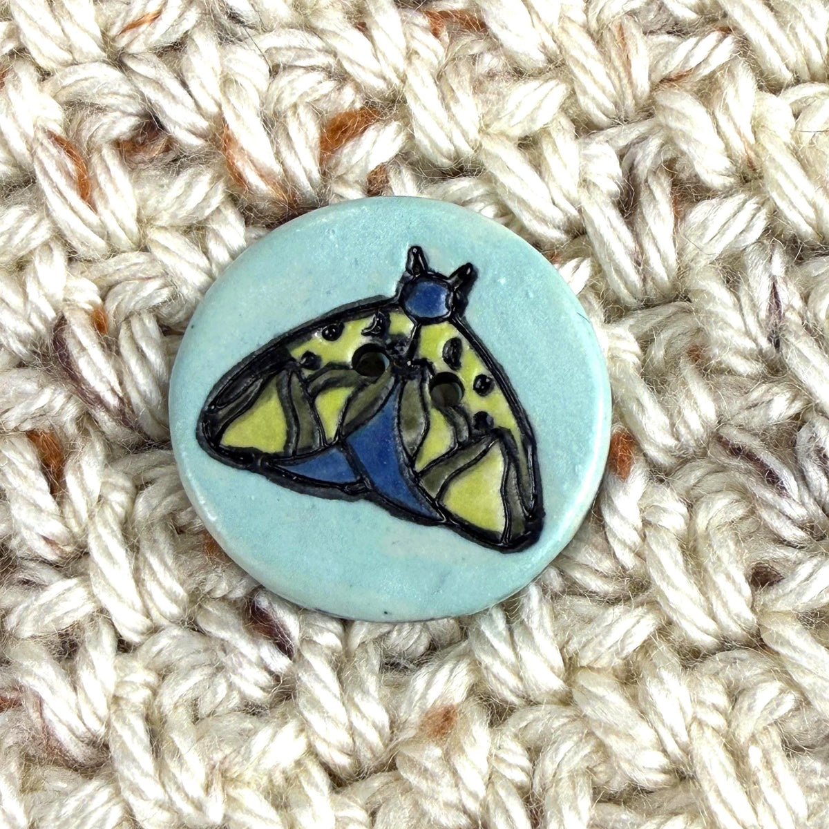 Dark Blue and Chartreuse Moth on Aqua Blue Ceramic Button