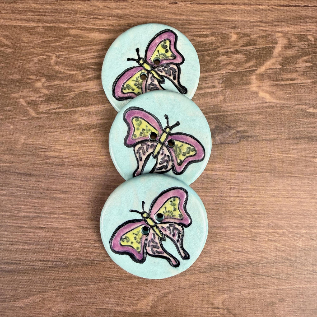 Red Violet Moth with Yellow on Aqua Blue Ceramic Button