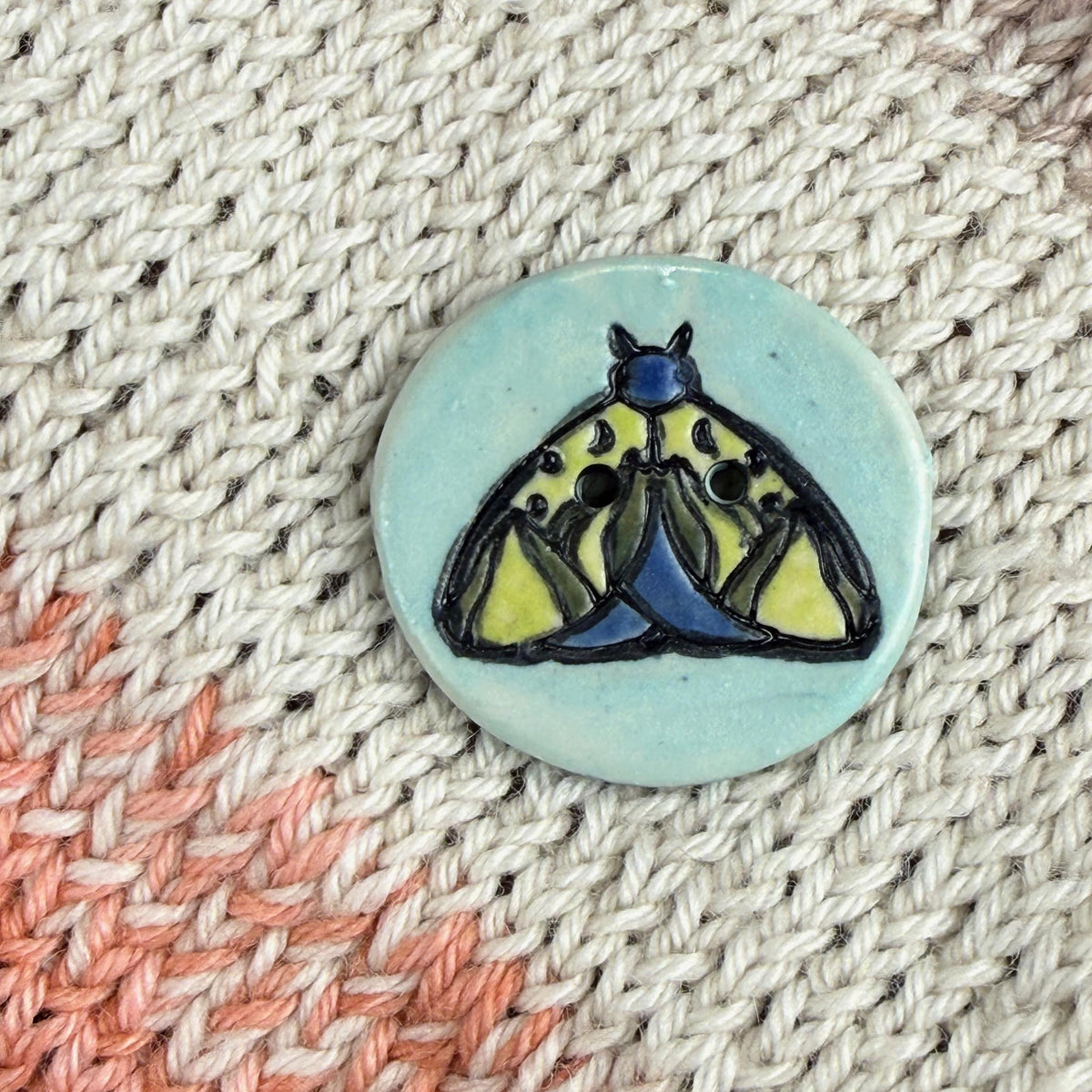 Dark Blue and Chartreuse Moth on Aqua Blue Ceramic Button