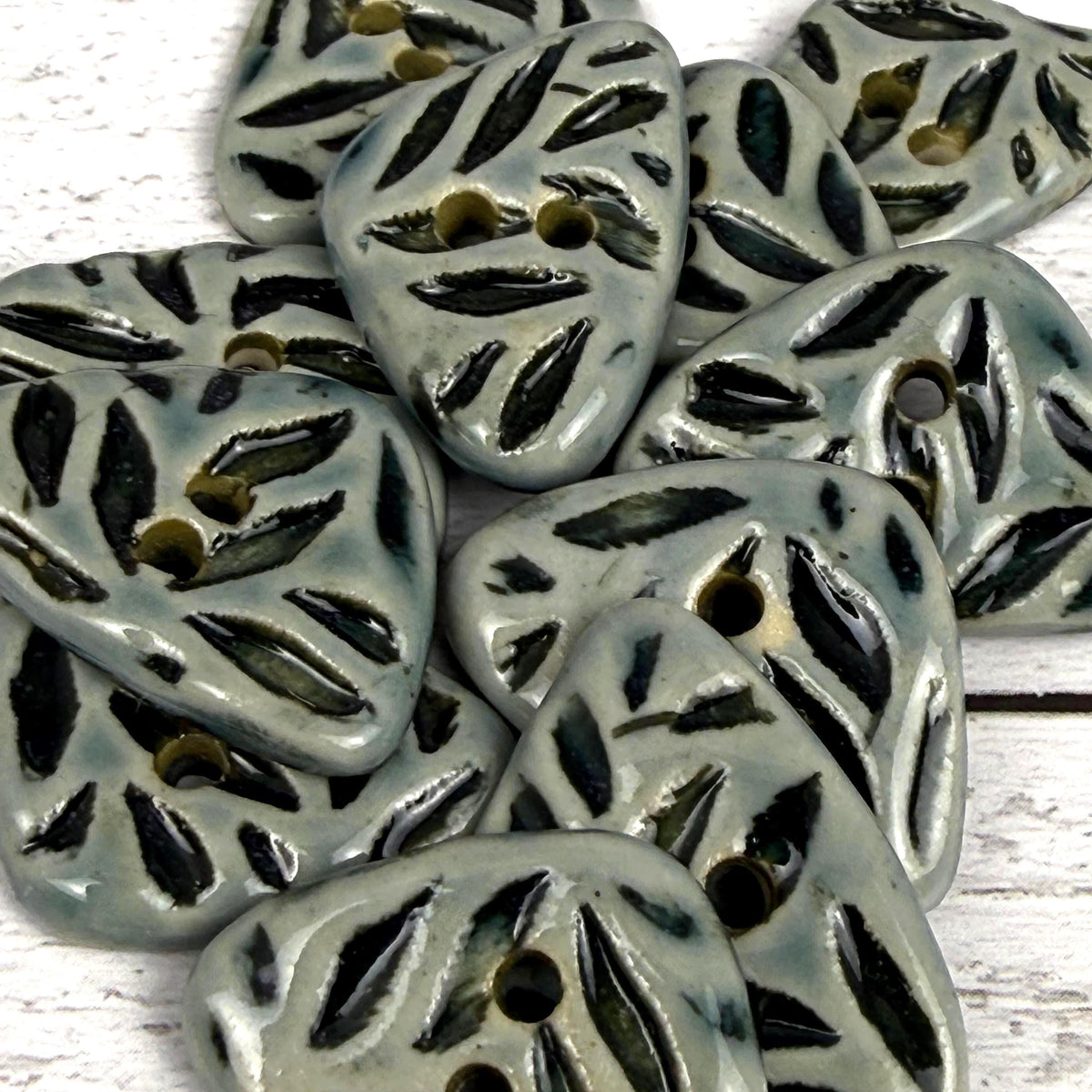 Small Triangular Shaped Buttons in Light Sage with Dark Sage Leaf Pattern