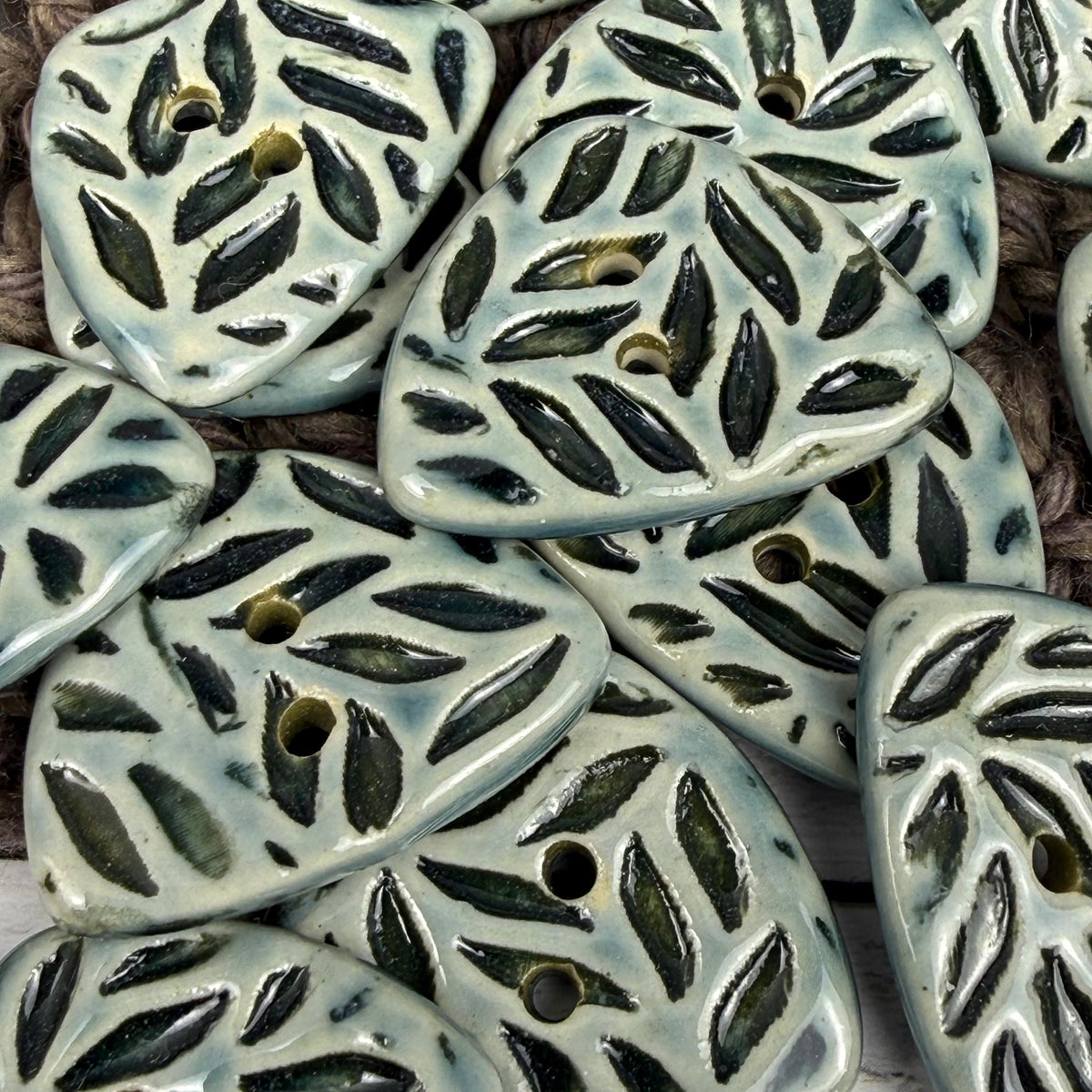 Triangular Shaped Buttons in Light Sage with Dark Sage Leaf Pattern