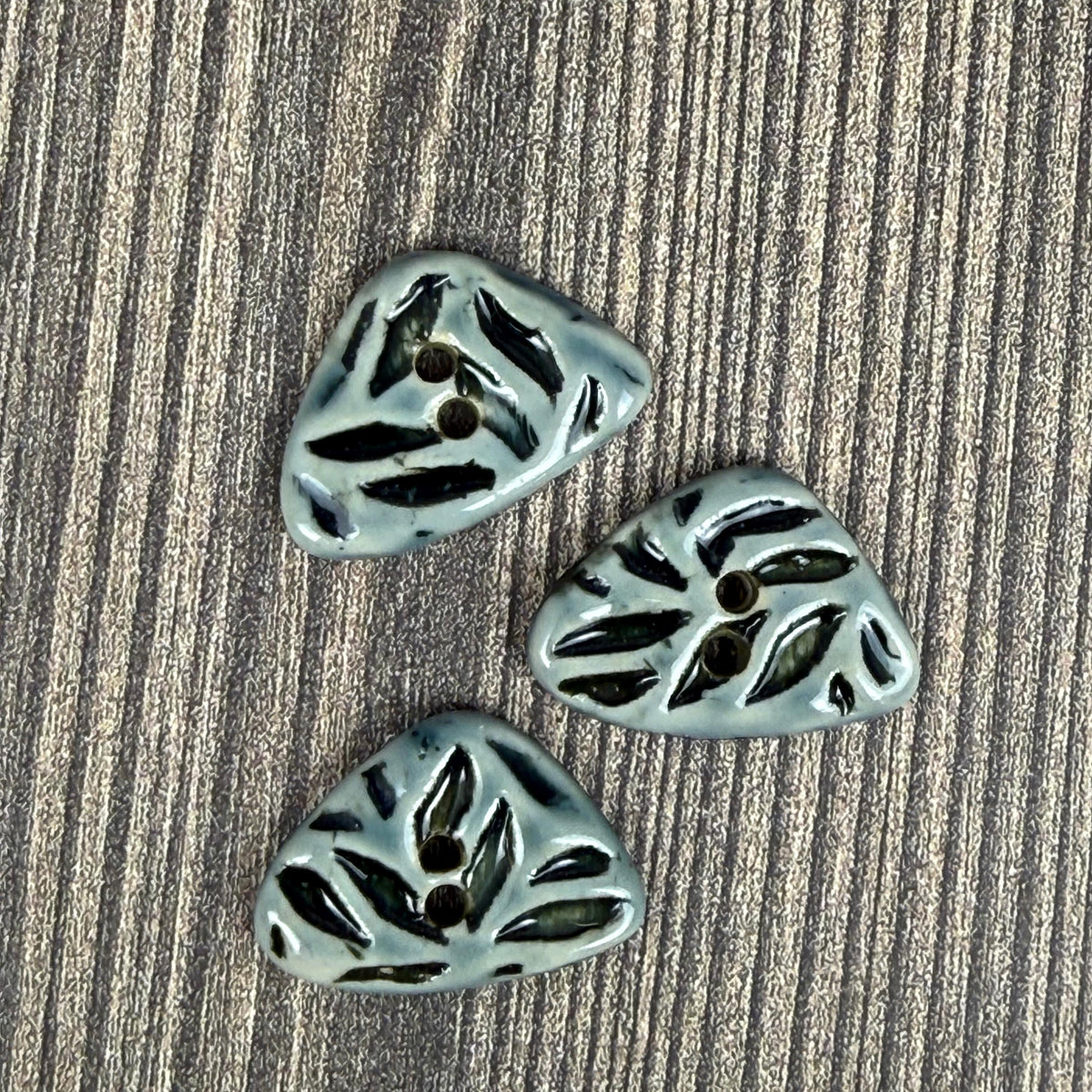 Small Triangular Shaped Buttons in Light Sage with Dark Sage Leaf Pattern